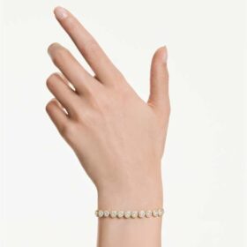 Brățară Una Angelic cu cristale tăiate rotund, albă, placată cu aur Brățară Una Angelic cu cristale tăiate rotund, albă, placată cu aur