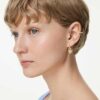 Cercei Idyllia cu pandantiv și cercei de tip „ear cuff”, tăieturi mixte, inimă cu cheie, roz, placare aurie Cercei Idyllia cu pandantiv și cercei de tip „ear cuff”, tăieturi mixte, inimă cu cheie, roz, placare aurie